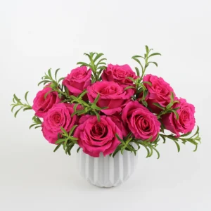 Hot pink rose arrangement with lush green foliage in a clean white vase, photographed against a white backdrop — a bold, tropical-inspired floral design called Miami Heatwave from Athletic Club Flower Shop.